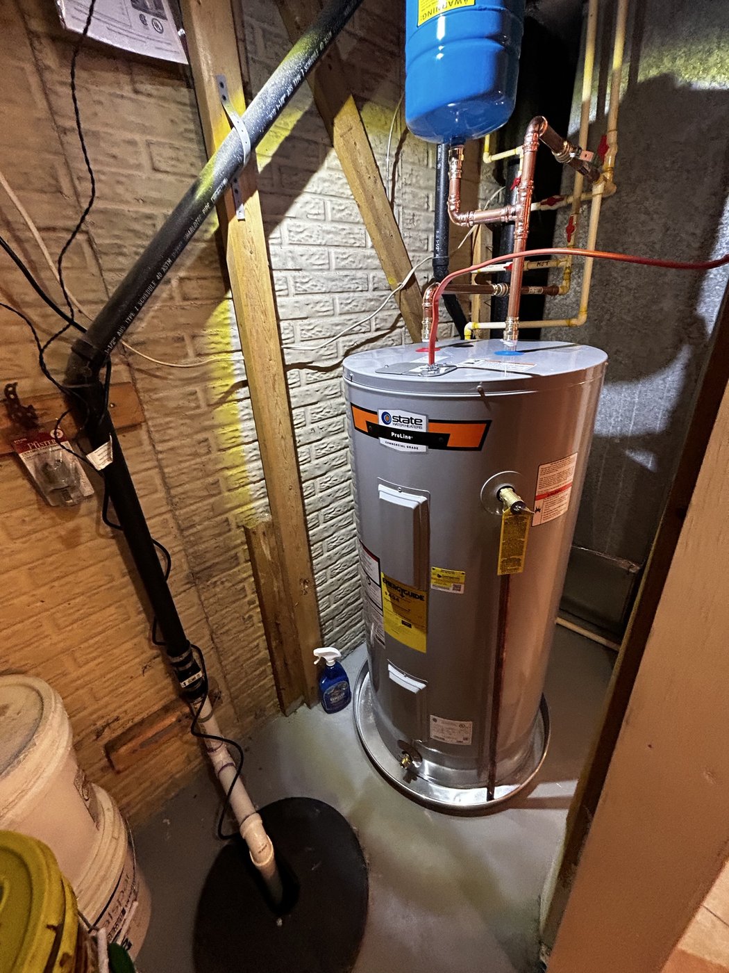 Commercial-grade water heater installation with copper piping completed by Mercy's Plumbing